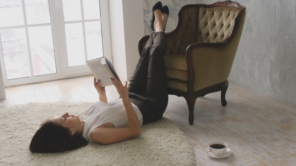 Reading a Book While Lying On The Floor alt