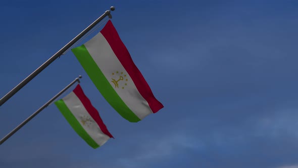 Tajikistan  Flags In The Blue Sky - 4K