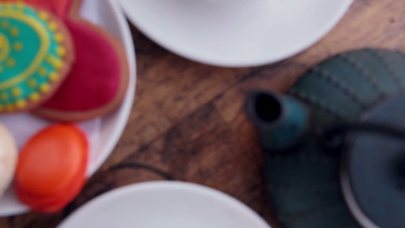 A Teapot And Cookies On a Vintage Table, Waiting For a Dating Couple. alt