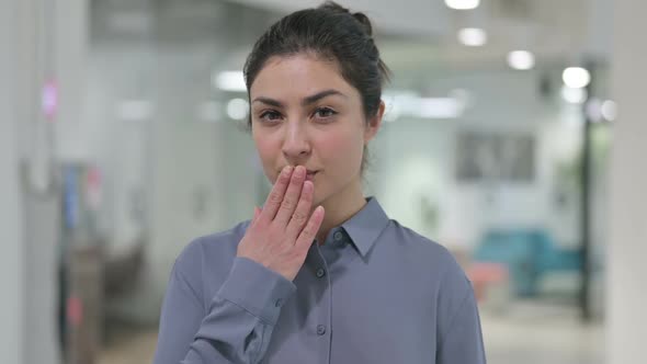 Portrait of Indian Woman Giving Flying Kiss alt