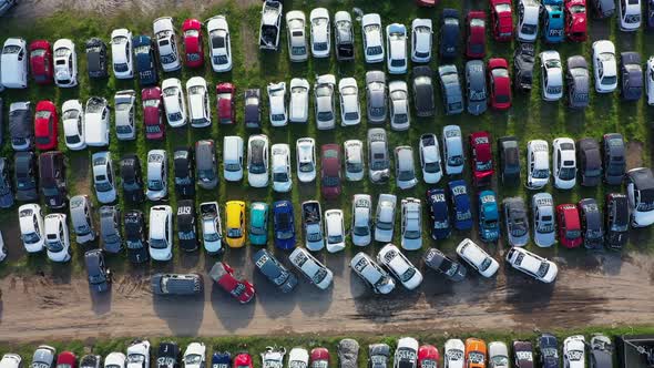 Lot of land with cars cars vehicles colorful old unusable abandoned alt