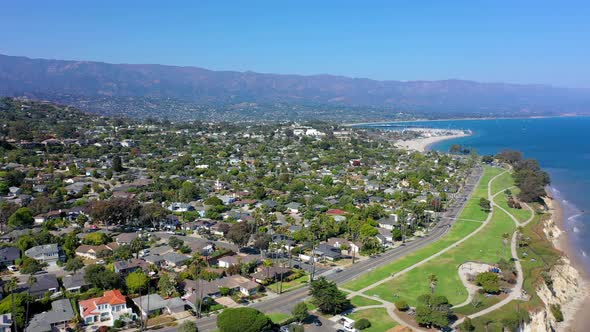 Santa Barbara beach and cliff drone panning right. alt