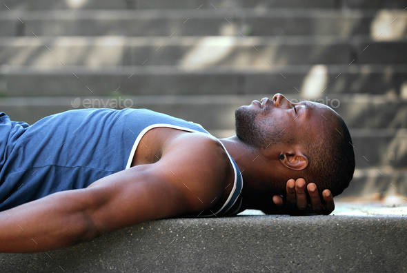 African american man sleeping outside