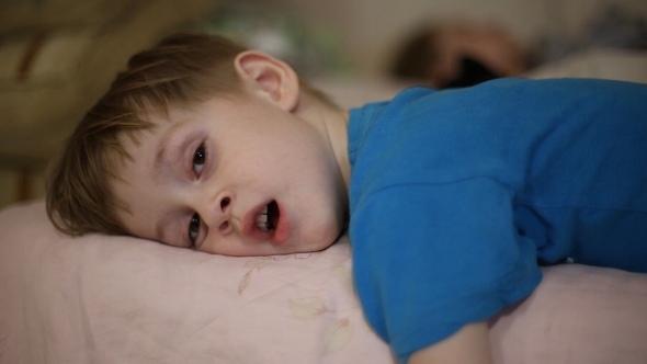 Little Boy Falls Asleep, He Yawns alt