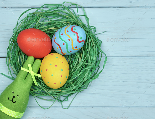 Easter eggs hand painted, rabbit, wood background - Stock Photo - Images