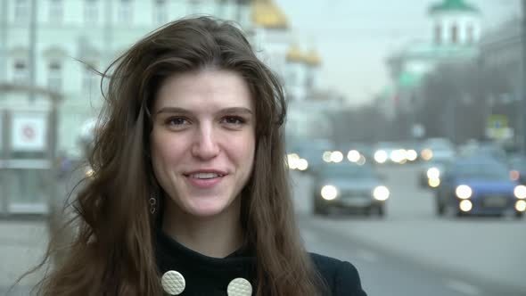Portrait Of The Young Woman On The Street.