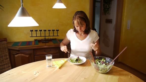 Smiling Woman Eating Salad On Breakfast