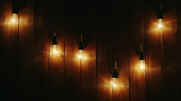 Garland Of Light Bulbs On a Wooden Background, Stock Footage | VideoHive