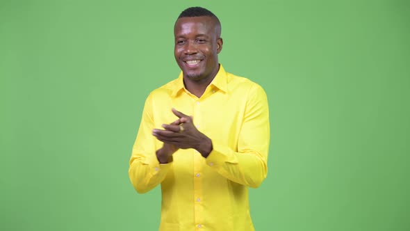 Young Happy African Businessman Clapping Hands alt