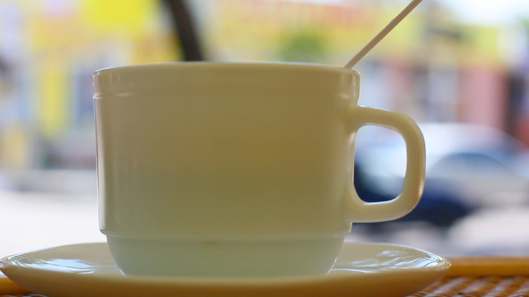 Coffee Cup In Street Restaurant With City Background