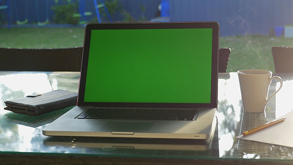 Laptop and Hot Drink in Morning Sunlight