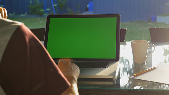 Working on a Laptop in the Morning Sun
