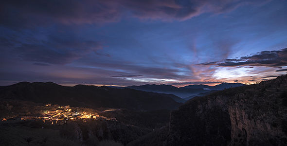 Mountain Sunset with Town and Clouds