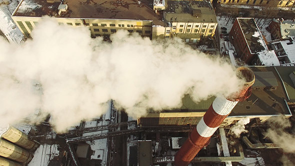 Aerial View of Pipes With Smoke alt