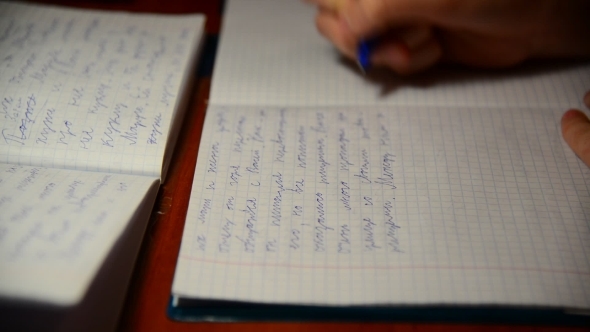  Boy Writes In Notebook Homework On Russian Language