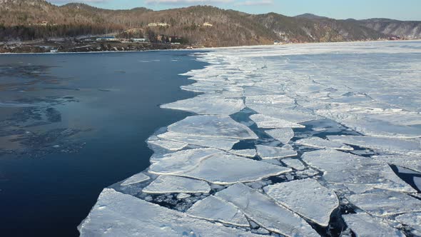 4k. Flight over Baikal lake and Angara river in winter. 