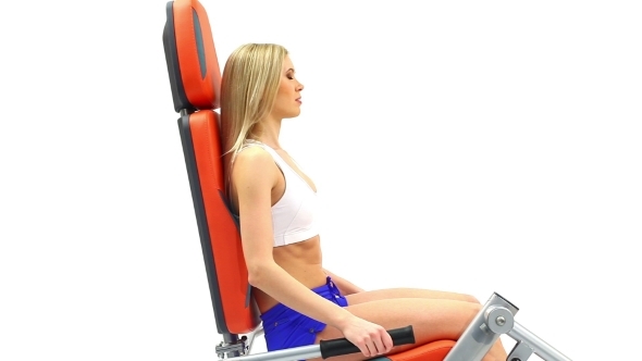 Attractive Blonde Exercising On Trainer
