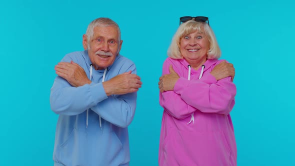 Cheerful Lovely Senior Couple Man Woman Grandparents Spread Hands and Give Hug to you Love Feelings alt