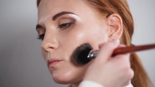 Close Up Shot of the Face of a Beautiful Woman Who Is Painted with Makeup alt