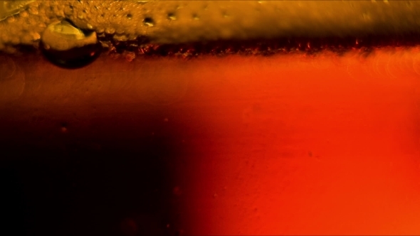 Beer Being Poured From a Glass alt