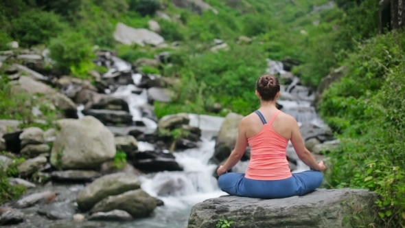 Woman Meditating At Tropical Waterfall alt