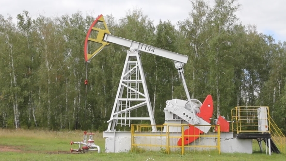 Oil Pump Working In The Forest. Oil Industry