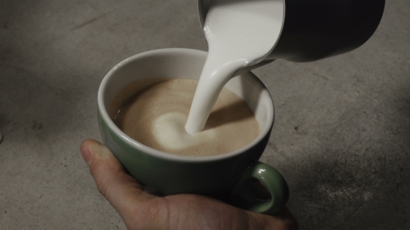 Barista Stirs The Milk And Making Cappuccino alt