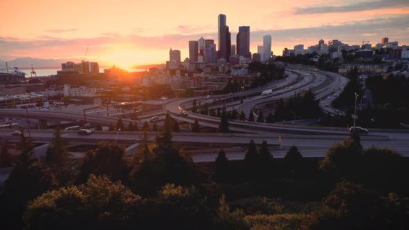 Glowing City Skyline Sunset Of People Driving Aerial