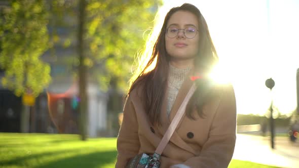 Slow Motion European Businesswoman Standing Sunlight Walking Citycenter Park Smiling Tilting Head alt
