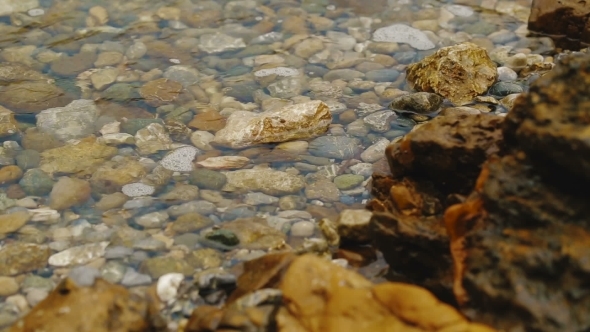 Colored Pebbles Under Water