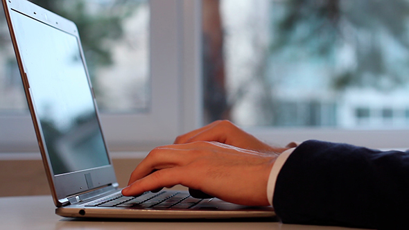 Man Working On Laptop alt