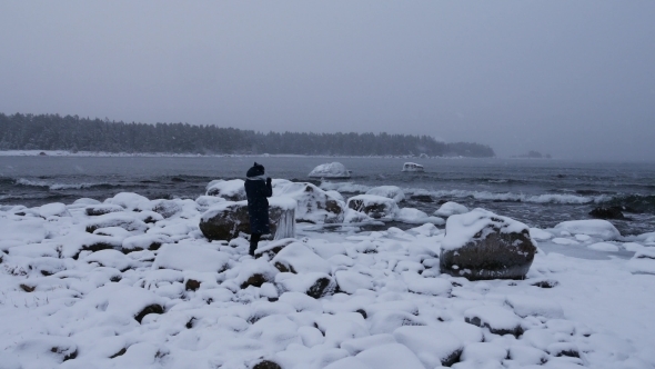 Caucasian Woman Taking Pictures And Enjoys Travel, Baltic Sea, Winter Sweden