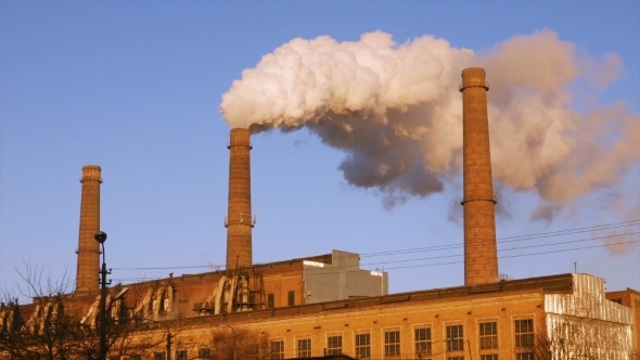 Factory Plant Smoke Stack Over Blue Sky Background