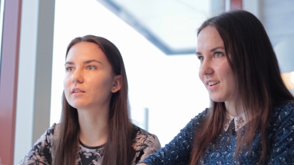 Twinsl Young Girls Talk In a Cafe In Winter