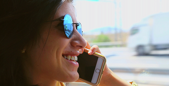 Girl Taking a Phone Call On a Bus Trip alt