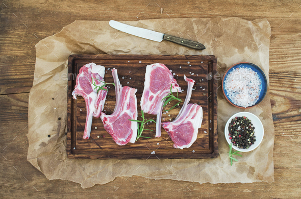 Raw lamb chops. Rack of Lamb with rosemary and spices - Stock Photo - Images