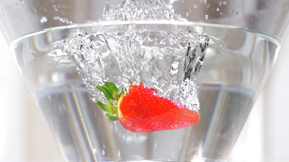 Strawberries Falling In Water