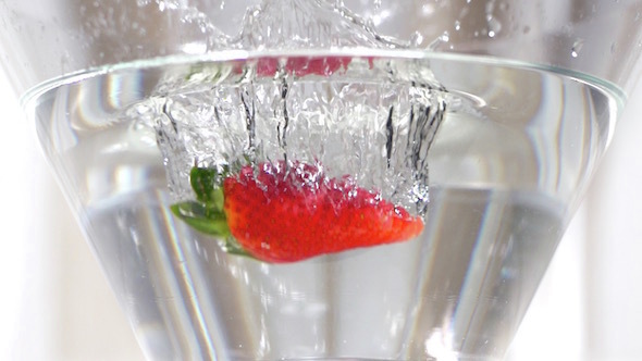 Strawberries Falling In Water