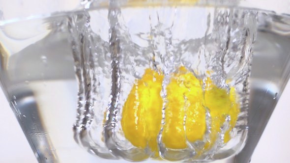 Lemon Falling Into Water