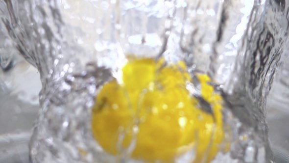 Lemon Falling Into Water