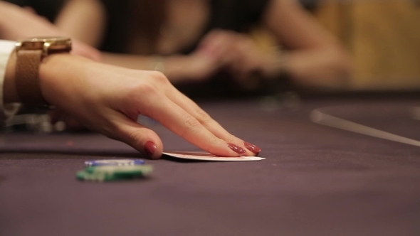 Woman Looking Cards In Poker