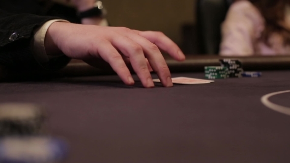 Man Knocks Fingers On The Table For Poker