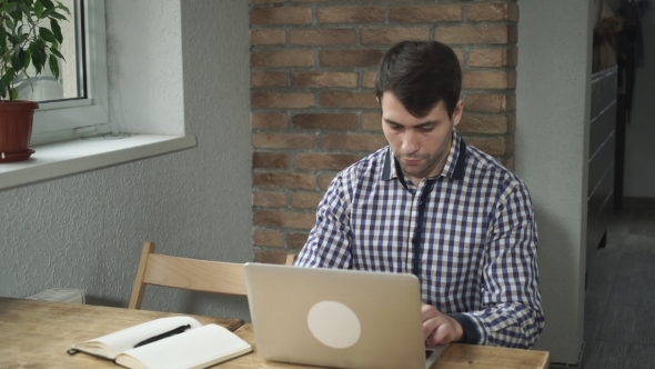 Man Concentrated Work At The Computer alt