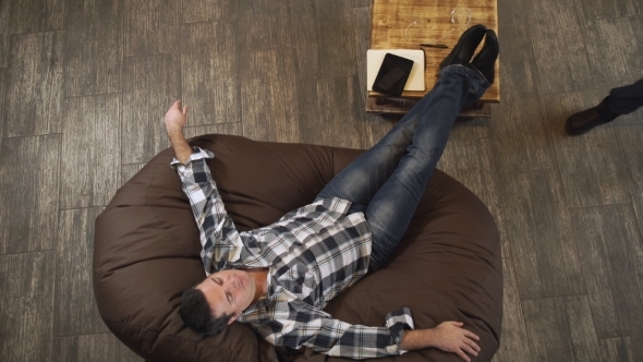 The Man Is Lying On The Couch,  alt