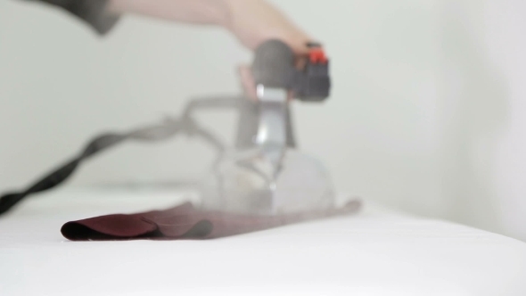 Iron. Ironing Board. a Worker's Hands At a Textile Factory. alt
