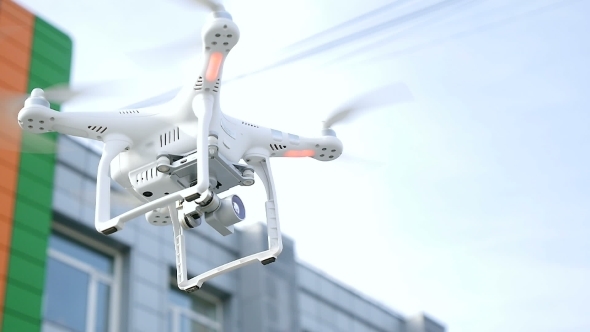 Aerial Drone Or Quadrocopter Flying In Air