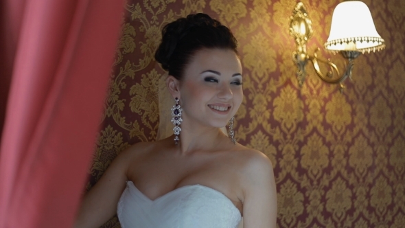 Happy Bride Pose To Photographer Indoor