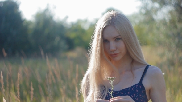 Nice Blonde Girl Send a Kiss Holding The Flower In Her Hands, Stock Footage