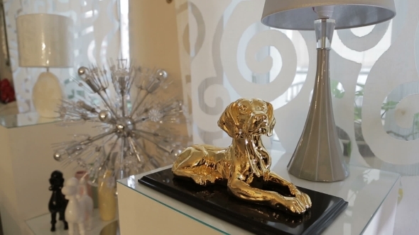Gold Figure Dog In Interior. Golden Dog. Golden Statuette