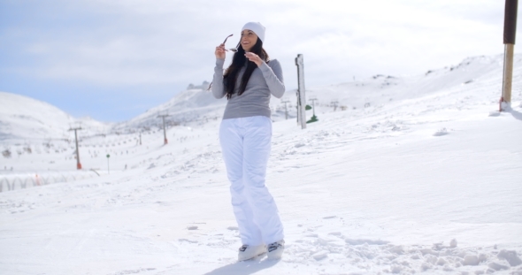 Attractive Young Woman Standing In Winter Snow alt